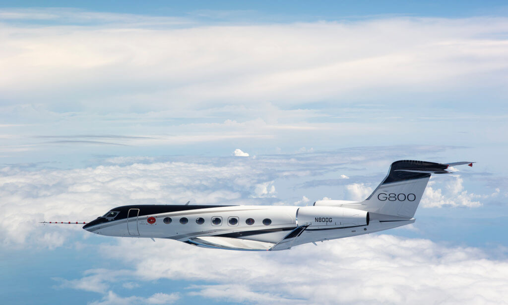 Gulfstream G800 private jet in a test flight over the white clouds 
