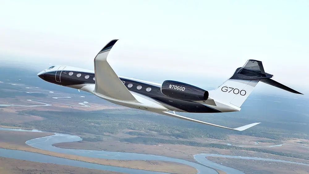 Gulfstream's largest black and white G700 private jet in flight 