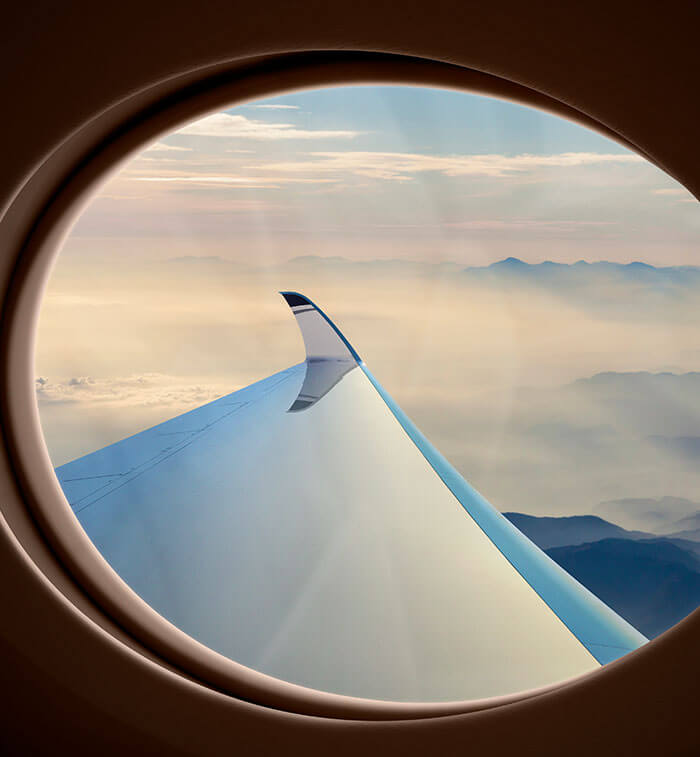 Gulfstream's largest oval windows overlook the wing and massive winglet on the G700 